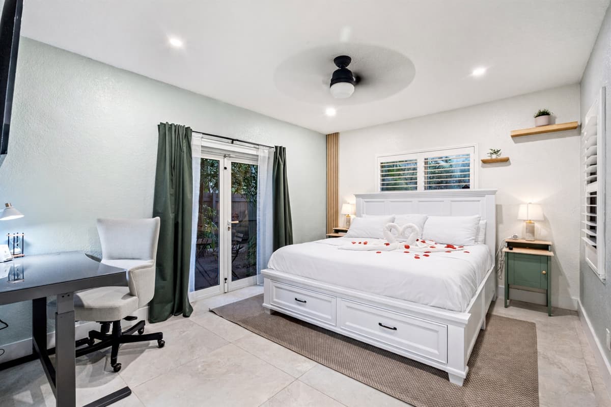 Spacious master retreat with ensuite bath and your own TV escape 🛏️.  Exit to your own private courtyard!