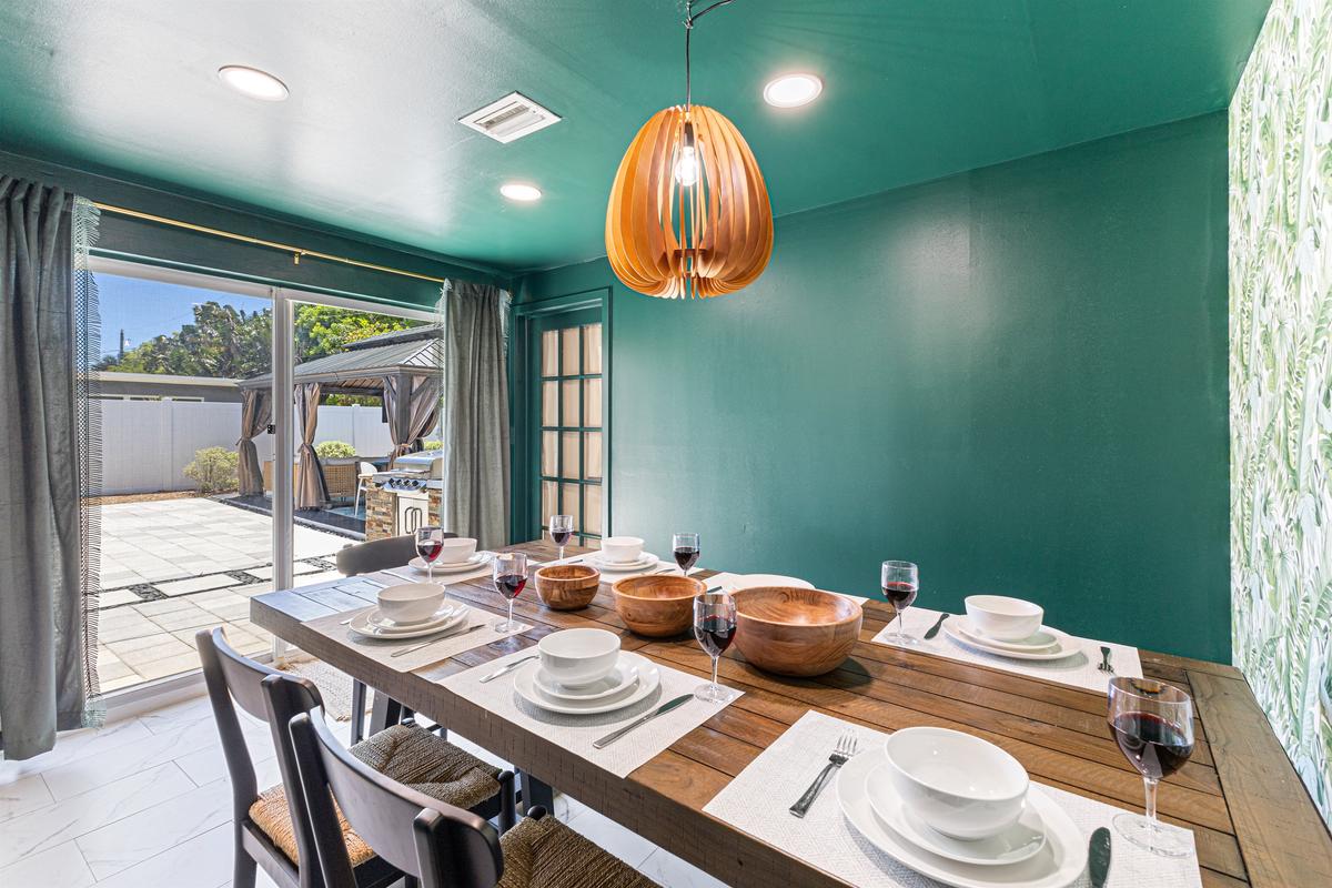 The dining room is filled with lots of natural sunlight